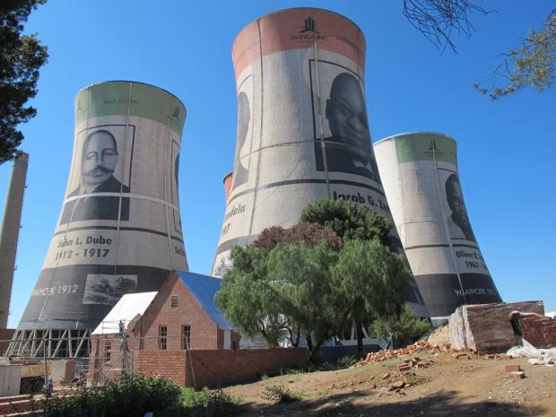 Cooling towers bedecked with portraits of ANC presidents soar over the Waaihoek Wesleyan Church, Bloemfontein, where the organisation was founded.Photograph credit: Jo-Anne Duggan, 2012