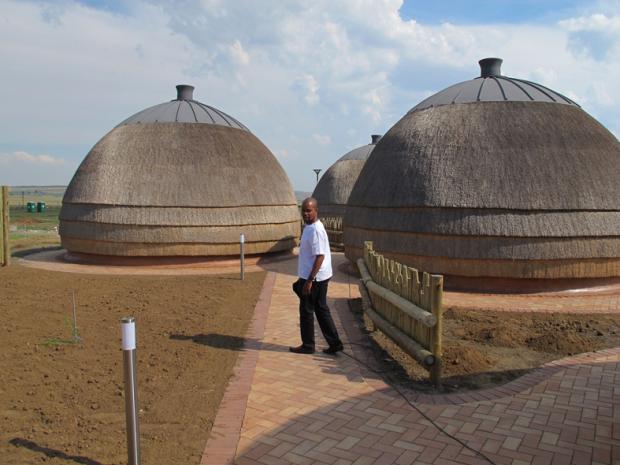 Mbongiseni Buthelezi explores the accommodation facilities under construction at the Ncome Heritage Site. Photograph credit: Jo-Anne Duggan, 2012 