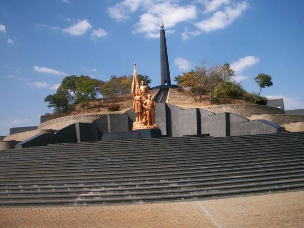 The Zimbabwean heroes acres with the Tomb of the Unknown Soldier in the foreground, the eternal fire tower in the background and elaborate stone work deco derived from the chevron pattern of the Great Zimbabwe archaeological site. (Picture by Author)