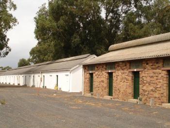 Barrack like dormitories defining a central space. These were built in the mid twentieth century. There were generally about 8 men to a room. Rooms were accessed by a single door with an upper window and a window to the rear. Ventilation was improved