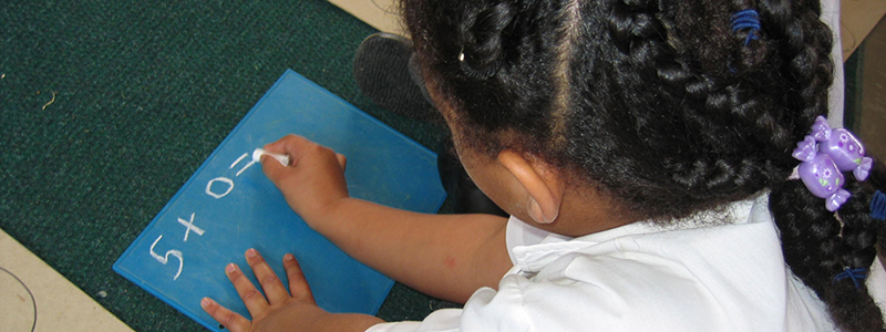 Child working at a maths problem