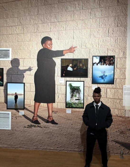 Thero in front of artwork