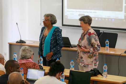 Lesley Green about to give a welcome note in Portuguese, standing to her right is Dra—Madalena, from the Fundacao Amilcar Cabral. 