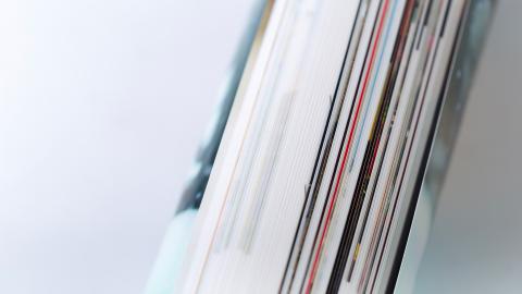 Close up view of a book laying on a flat surface during daylight hours stock photo